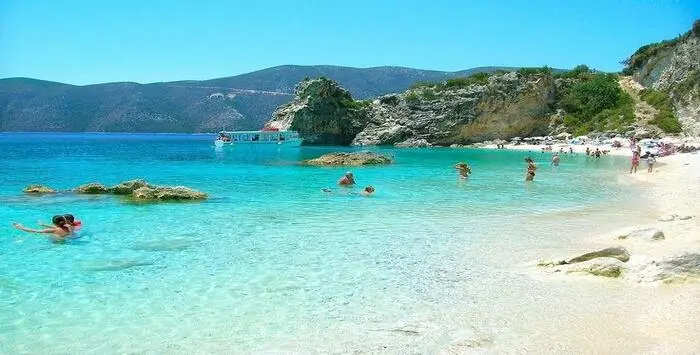Agiofili Beach in Lefkada, Greece with turquoise water, white pebbles, and cliffs