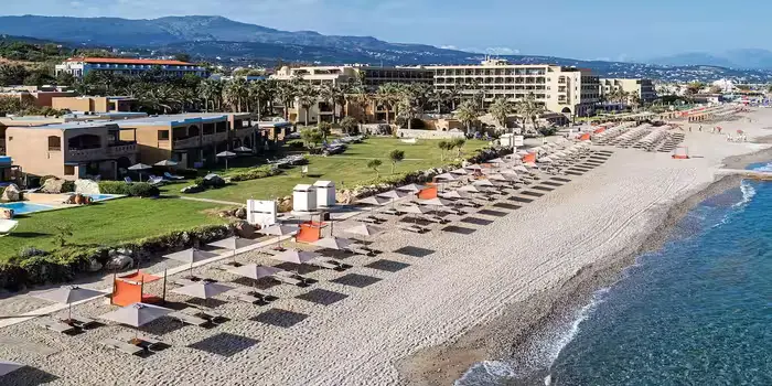 Aquila Rithymna Beach resort in Crete, Greece, featuring a sandy beachfront, clear Aegean Sea, and luxury seaside setting