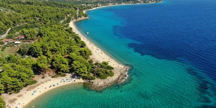 Lagomandra Beach in Sithonia Greece with clear turquoise water and sandy shoreline