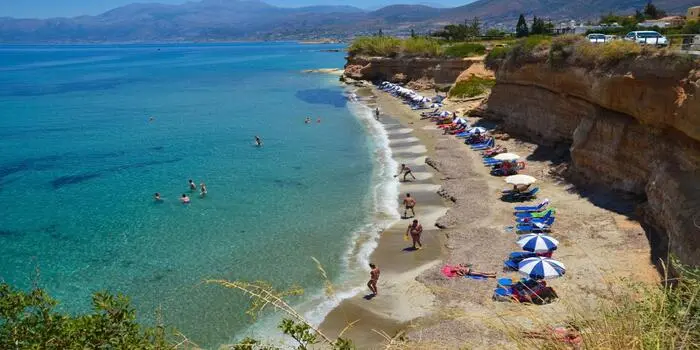 Sarantari Beach in Hersonissos, Crete with clear turquoise water and small sandy coves