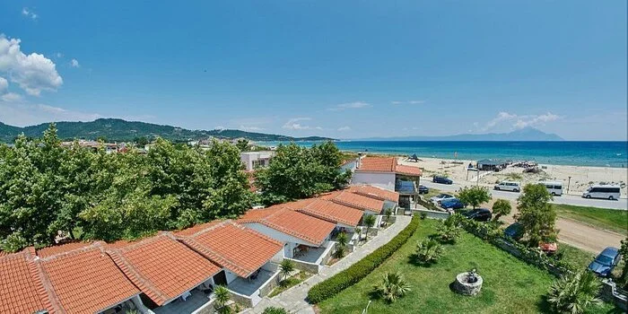Sarti Beach in Halkidiki, Greece with clear water, sandy shore and Mount Athos view