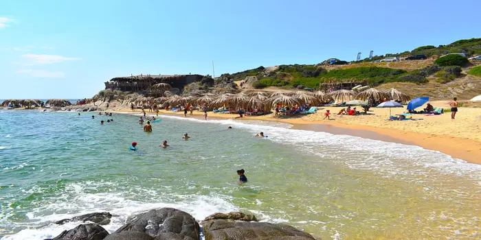 Tigania Beach in Samos, Greece with crystal clear Aegean water and a quiet pebble shoreline